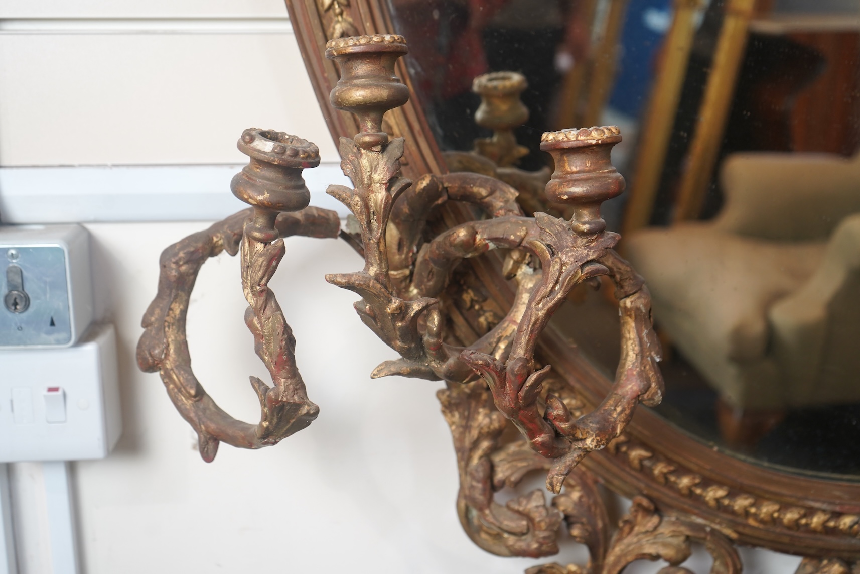 A large Louis XVI style gilt and composition girandole wall mirror